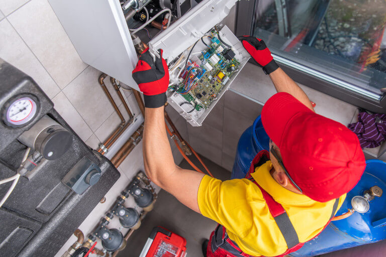 Residential Furnace Repair Performed by Professional Technician